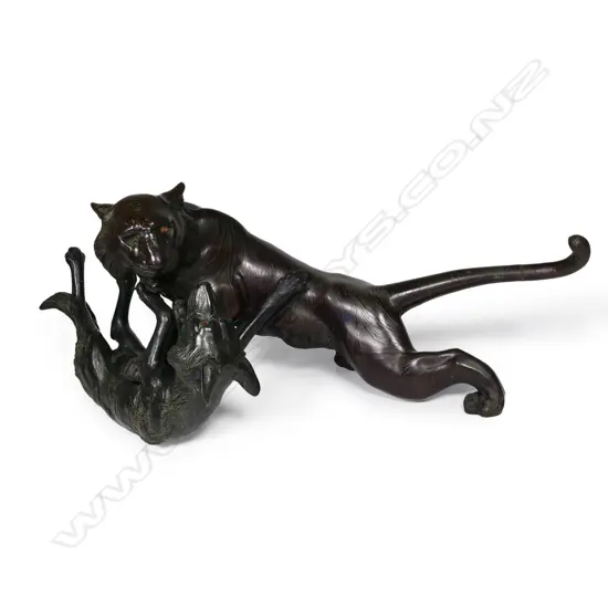 A large Japanese Meiji bronze figural group of a tiger being attacked by a wolf,