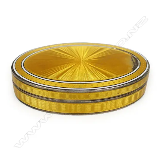 An early 20thC Asprey silver and yellow guilloche enamel lidded box,