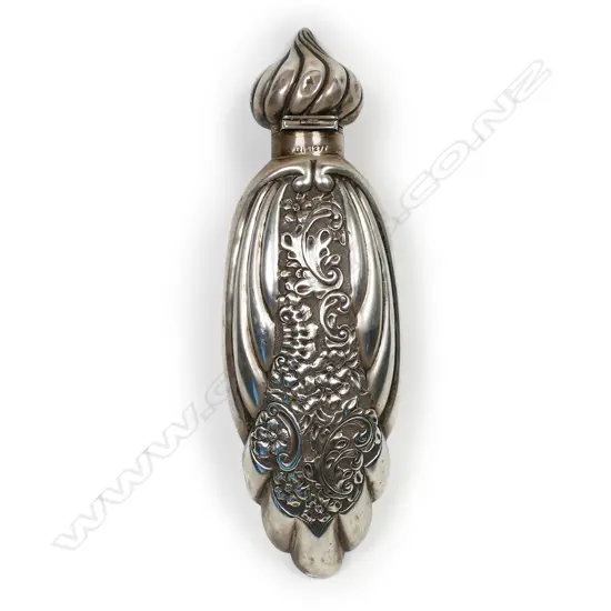 A large stylish late Victorian silver embossed scent bottle,