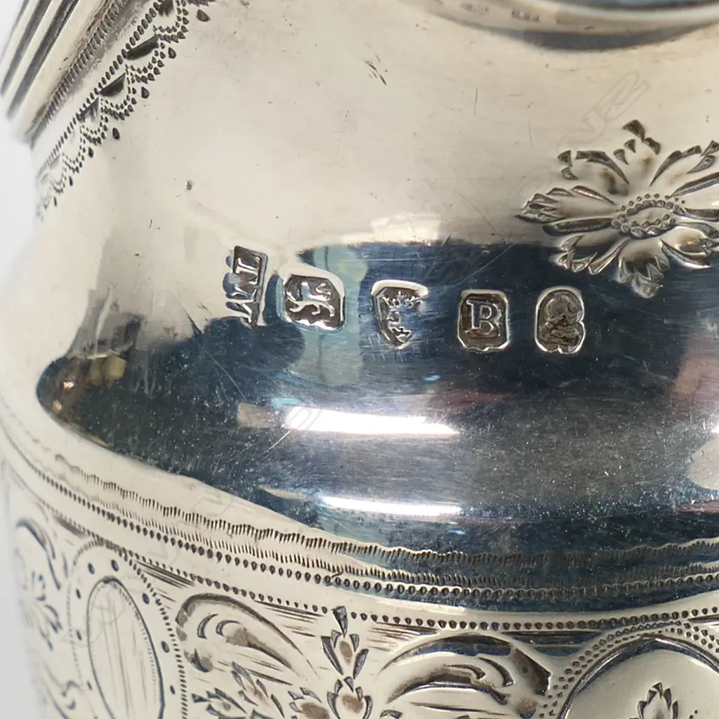 A George III silver flat bottom cream jug, Image 1++