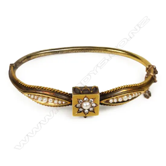 A Victorian 15ct gold diamond and seed pearl hinged bangle,