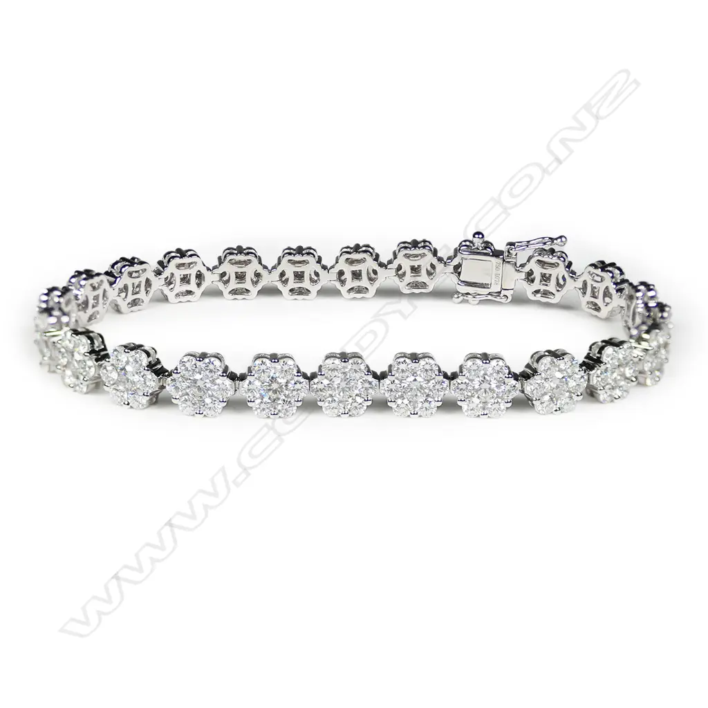 An 18ct white gold and multi diamond bracelet, Image 1++
