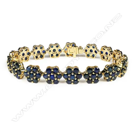 A 14ct gold sapphire floral design bracelet,