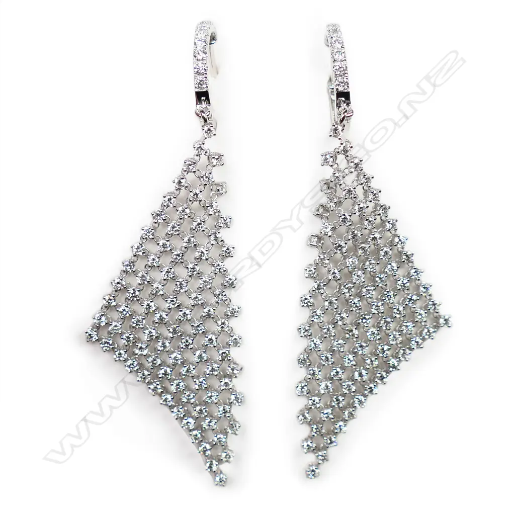A pair of 18ct white gold and diamond earrings, Image 1++