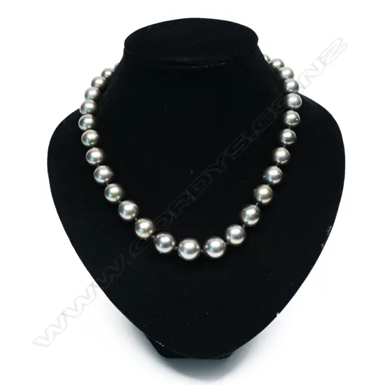 An impressive South Seas black pearl gold and diamond necklace,