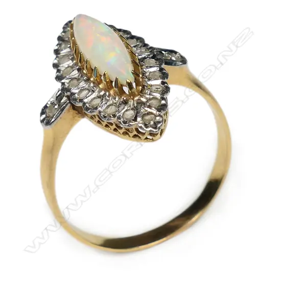An 18ct gold opal and diamond ring,