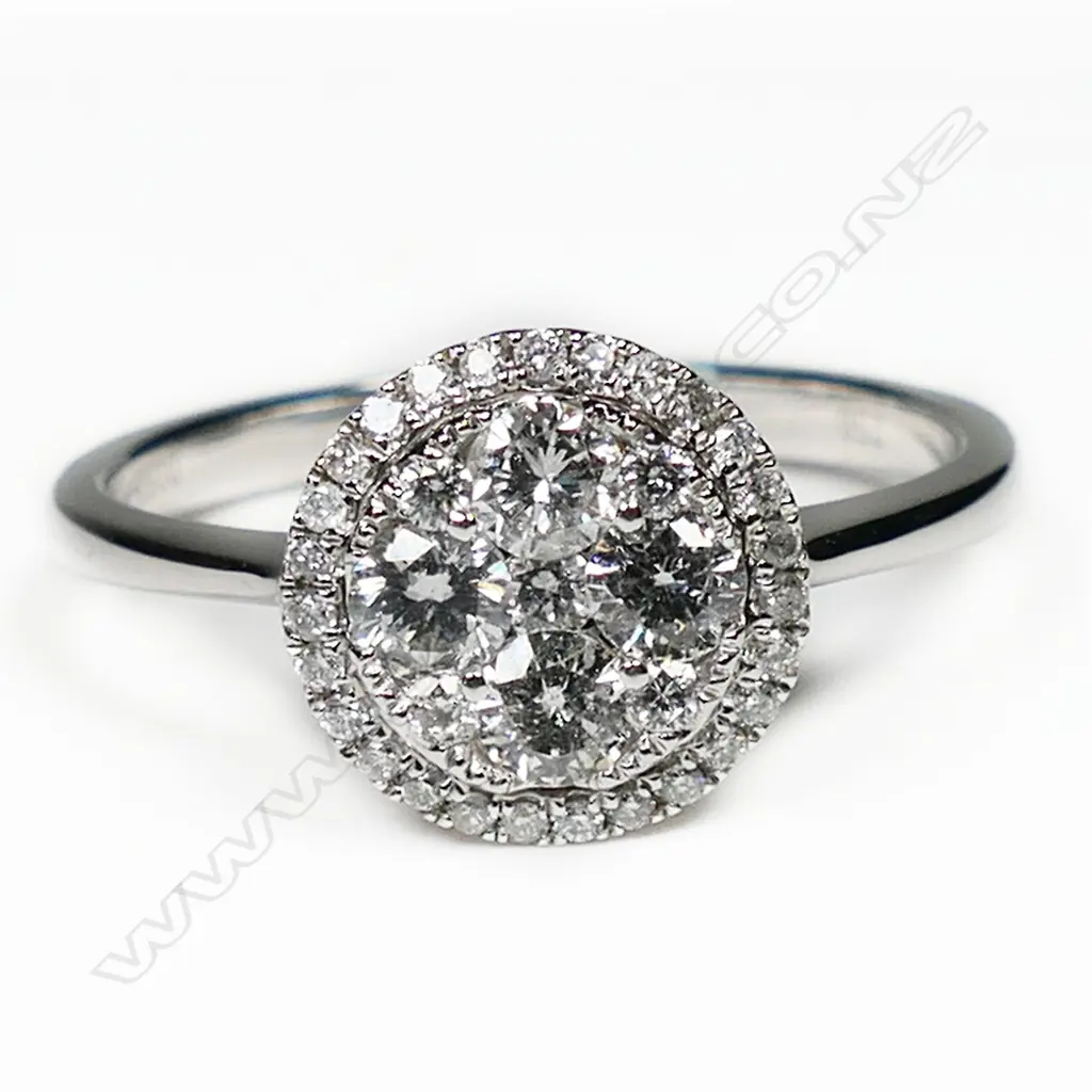 An 18ct white gold and diamond cluster ring, Image 1++