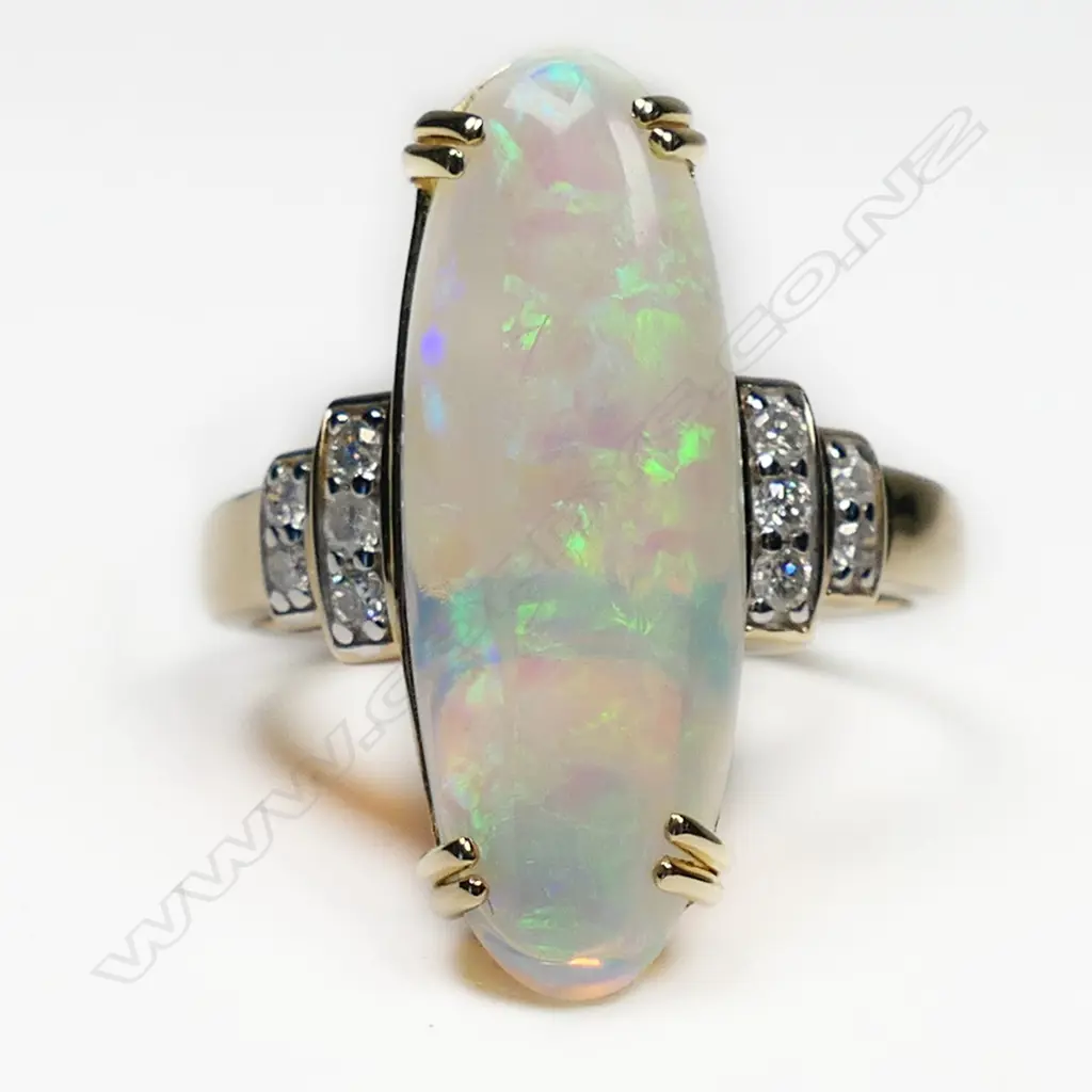 A 14ct gold opal and diamond trilogy style ring, Image 1++