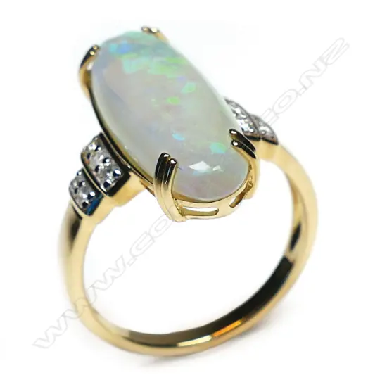 A 14ct gold opal and diamond trilogy style ring,