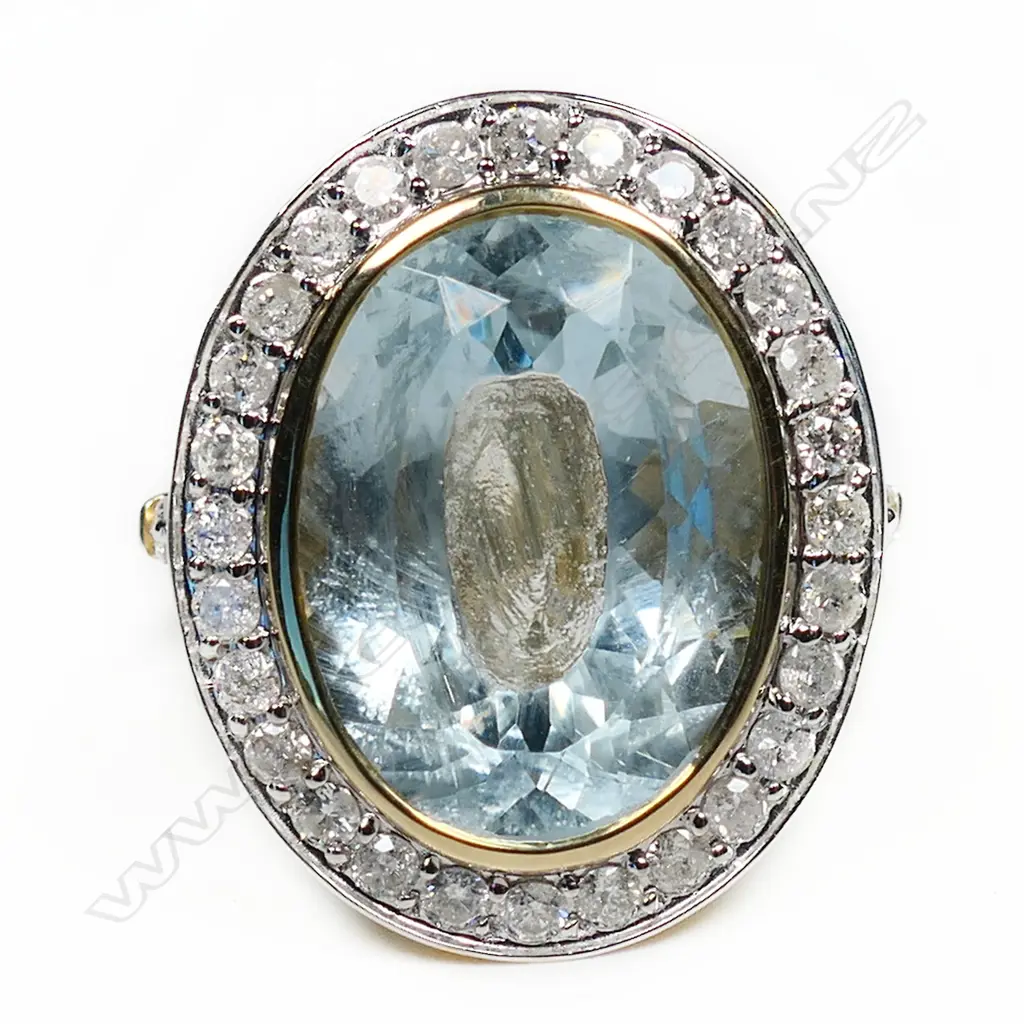 A 14ct gold aquamarine and diamond halo cocktail ring, Image 1++