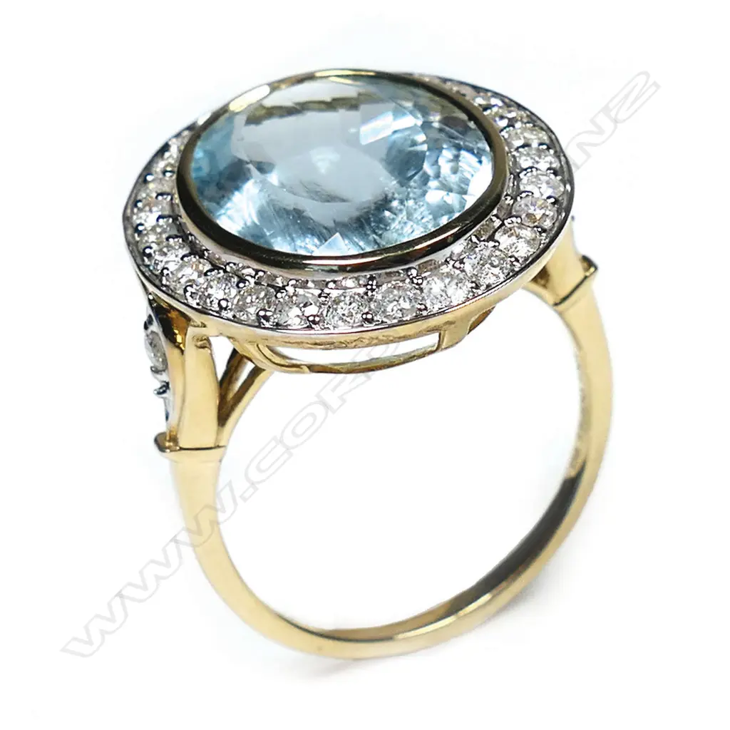 A 14ct gold aquamarine and diamond halo cocktail ring, Image 1++