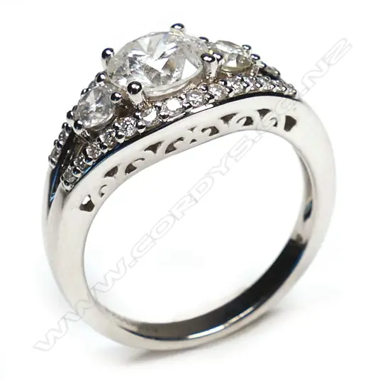 A 14ct white gold and diamond trilogy ring,