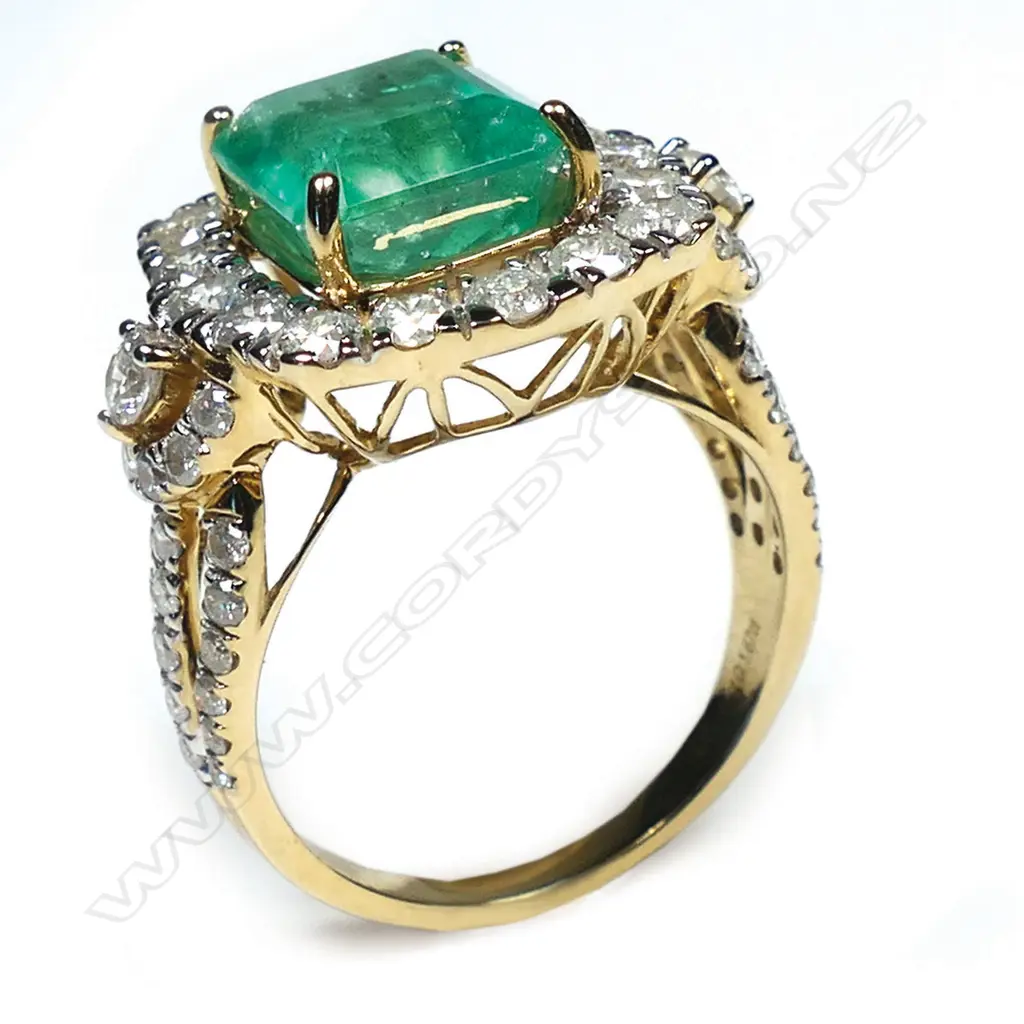 A 14ct gold Colombian emerald and diamond cluster ring, Image 1++