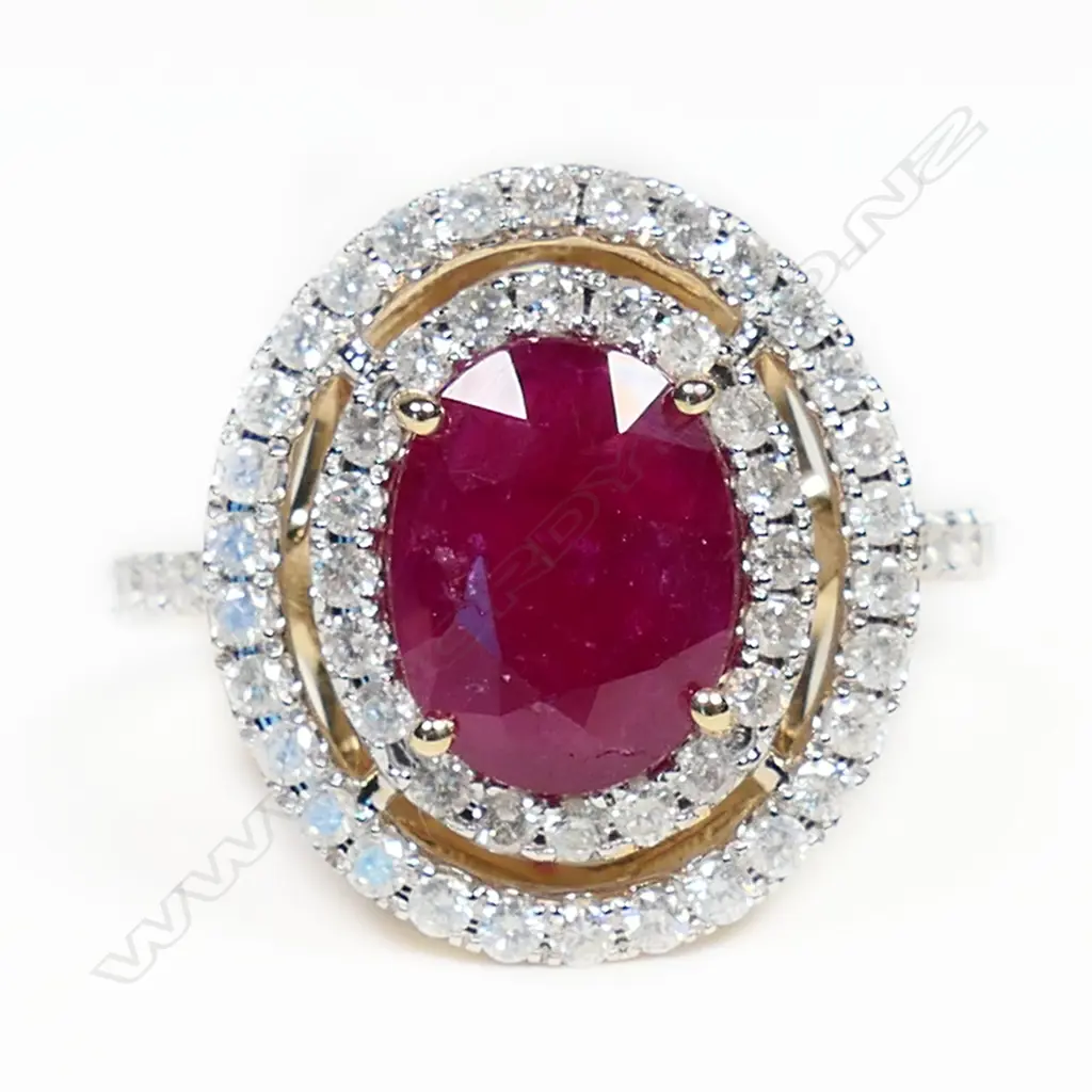 A 14ct gold ruby and diamond double halo ring, Image 1++