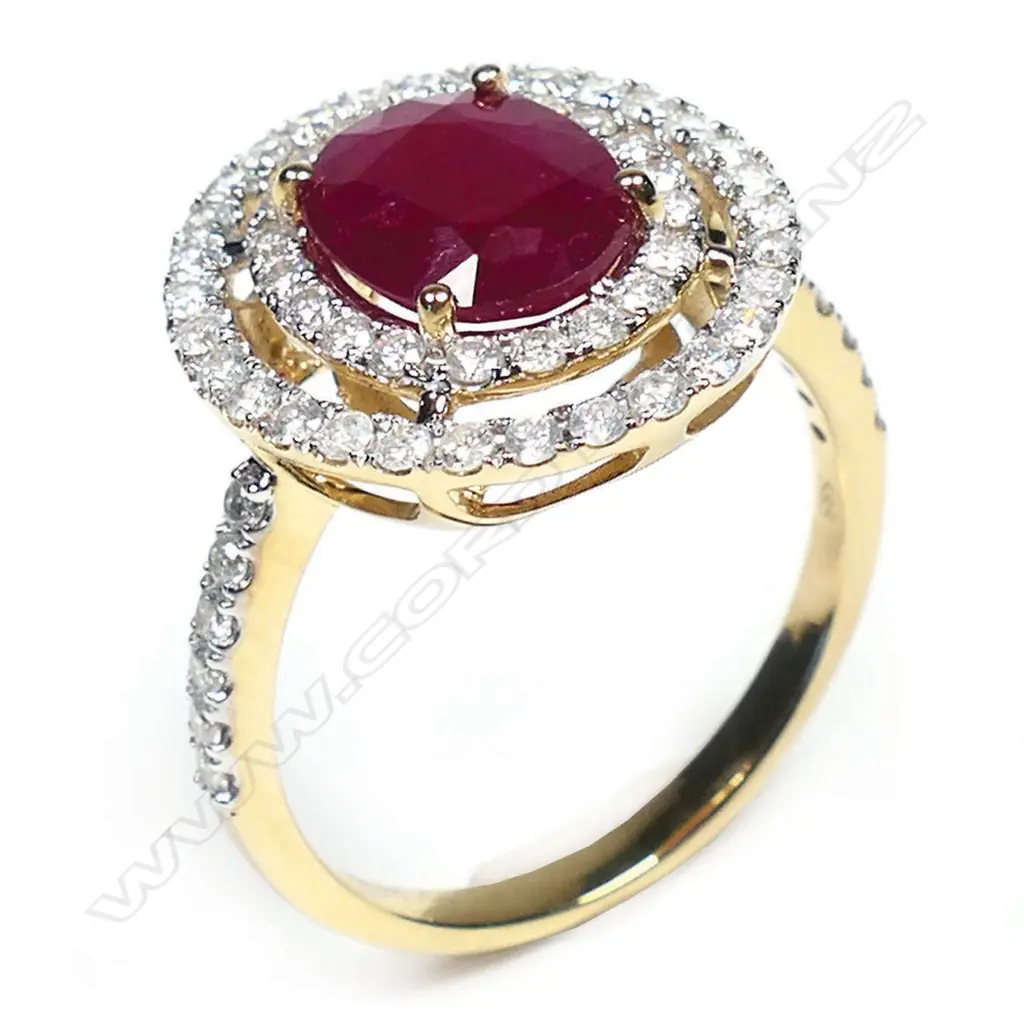 A 14ct gold ruby and diamond double halo ring, Image 1++