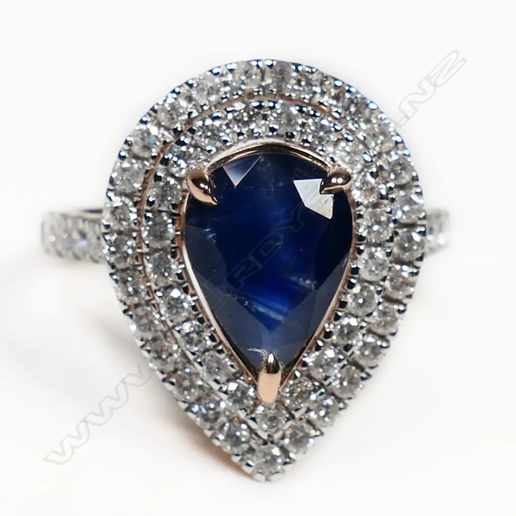 A 14ct rose gold sapphire and diamond double halo ring, Image 1++