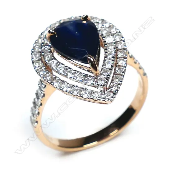 A 14ct rose gold sapphire and diamond double halo ring,