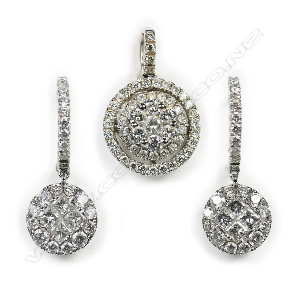 An 18ct white gold and multi diamond pair of earrings and pendant suite, Image 1++