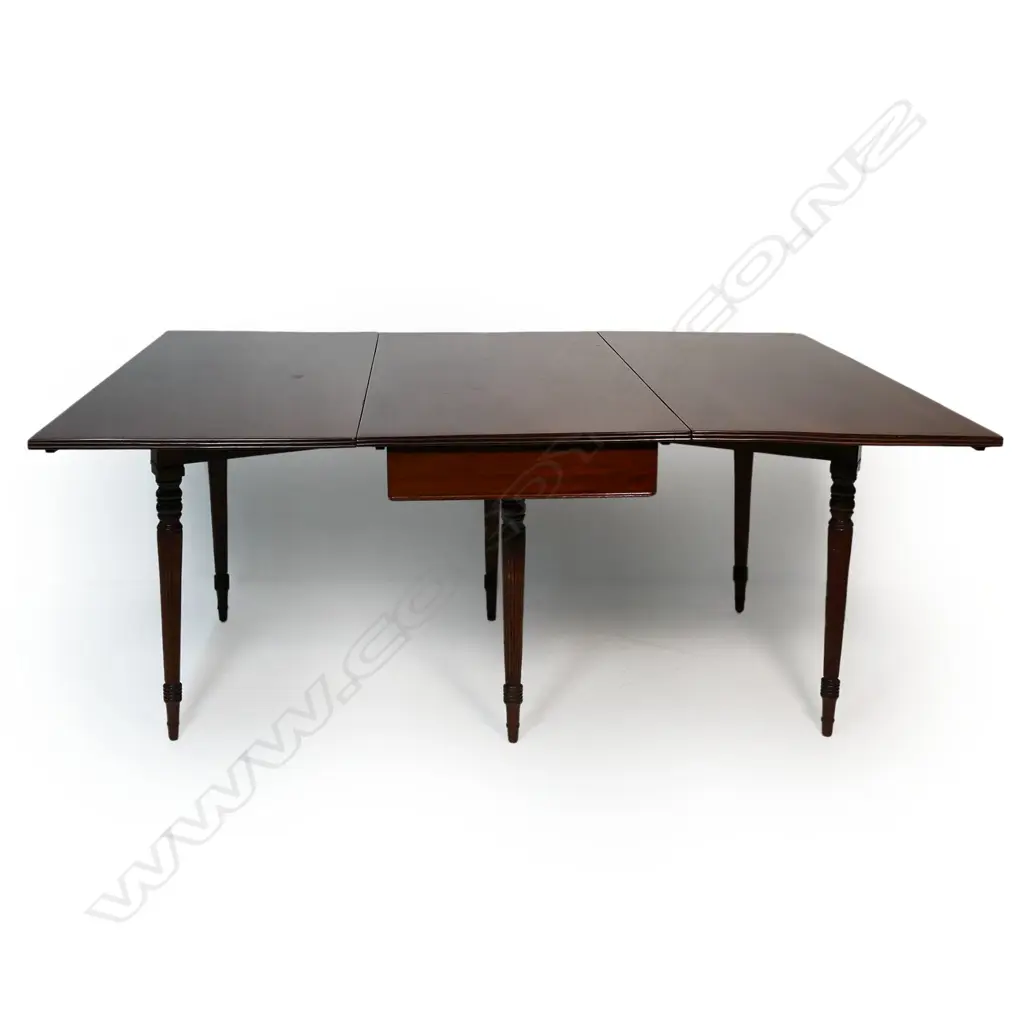 A late Georgian mahogany drop leave D-end dining table, Image 1++