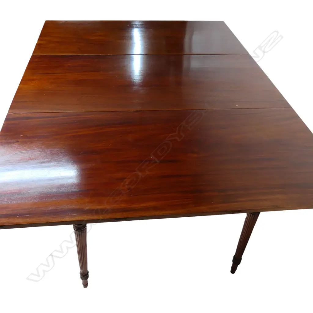A late Georgian mahogany drop leave D-end dining table, Image 1++