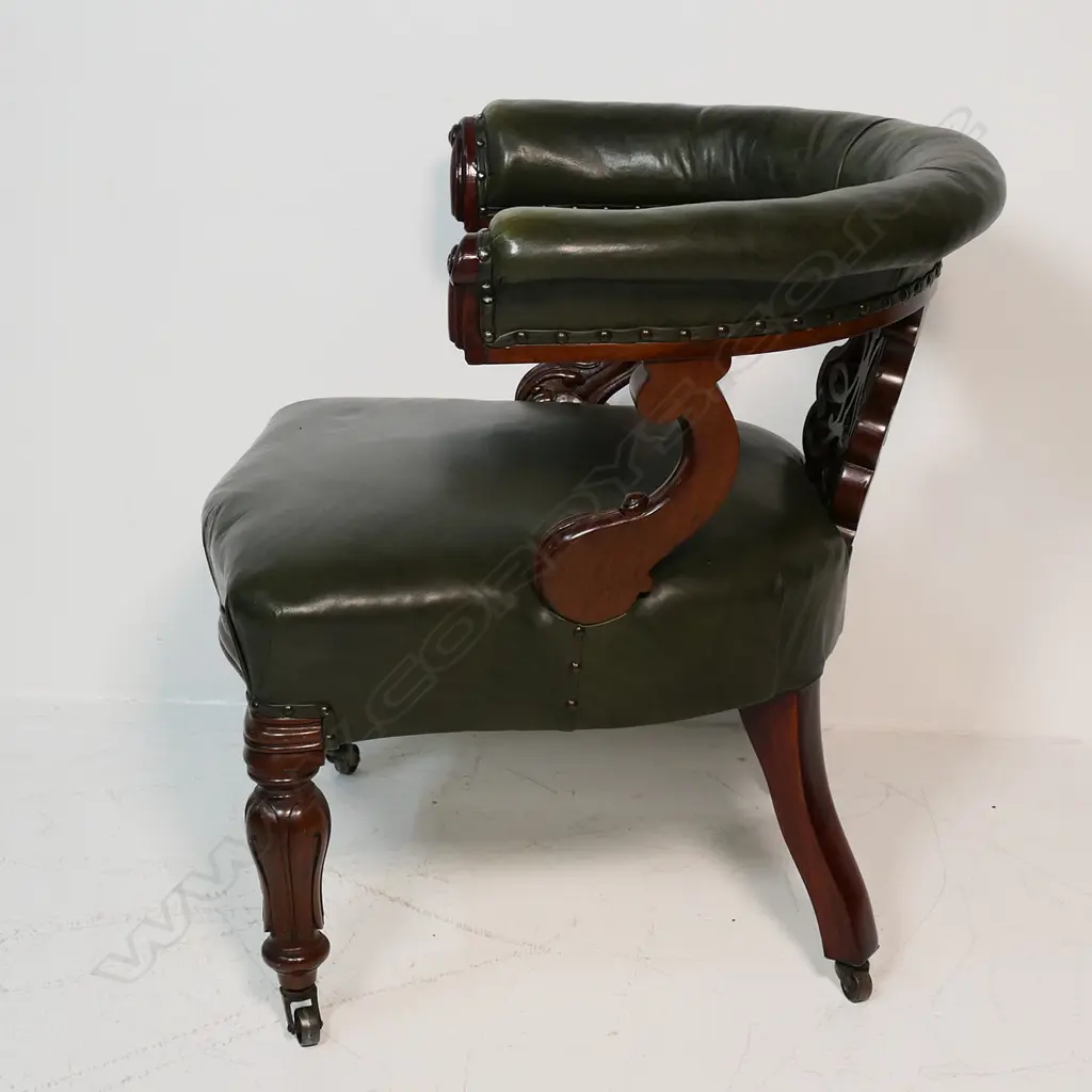 A Victorian mahogany and leather upholstered desk chair, Image 1++