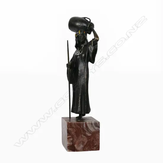 A cast bronze figure of an Arabic water carrier - in the manner of Franz Xaver Bergmann. H.190mm,