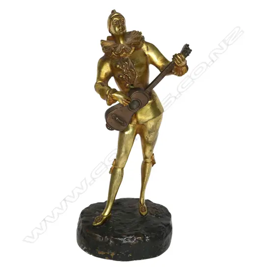 A statuette after Louis Mascré (1871-1929), 'Pierrot a la Mandoline', parcel gilt bronze, unsigned. H.310mm,