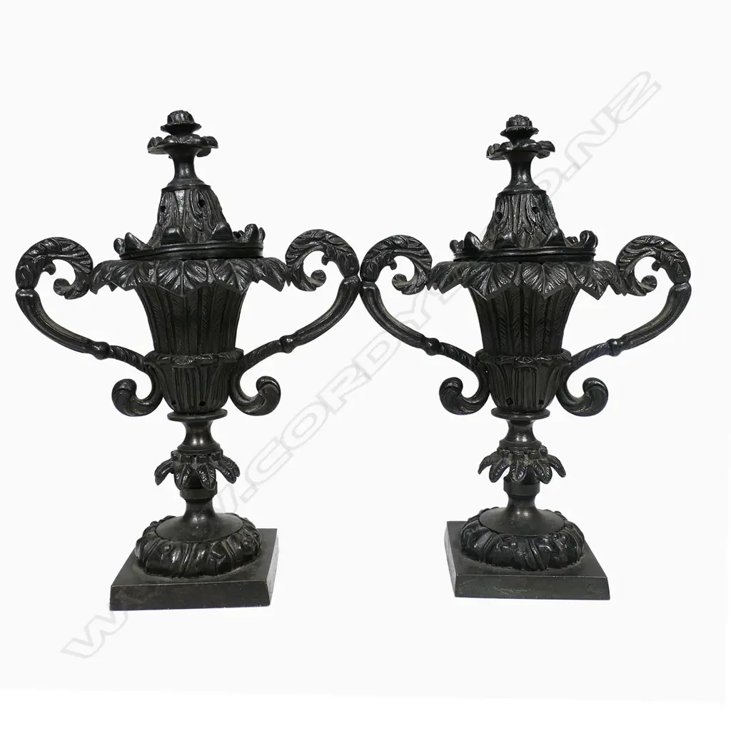 A pair of Regency period bronze pastille burners, of campana urn shape - with acanthus capped scroll handles and raised on palm frond knopped columns from square plinth bases. The covers with conforming palm fronds and foliate finials. H.190mm, Image 1++