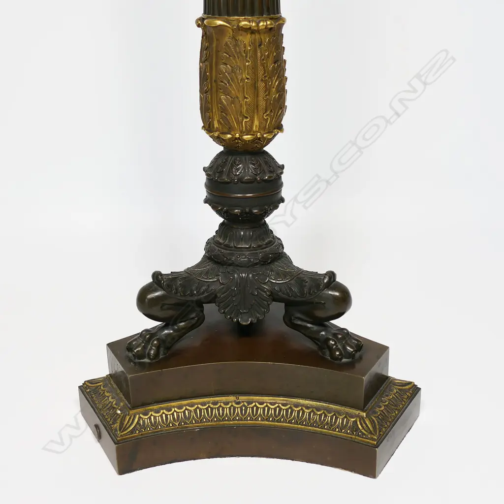 A quality 19thC Napoleon III Empire bronze table candelabra - gilt and patinated highlights to the four scrolling arms and five nozzles, acanthus leaf detail, raised on three lion's paw and leg feet, with conforming platform base. H.705mm. Image 1++
