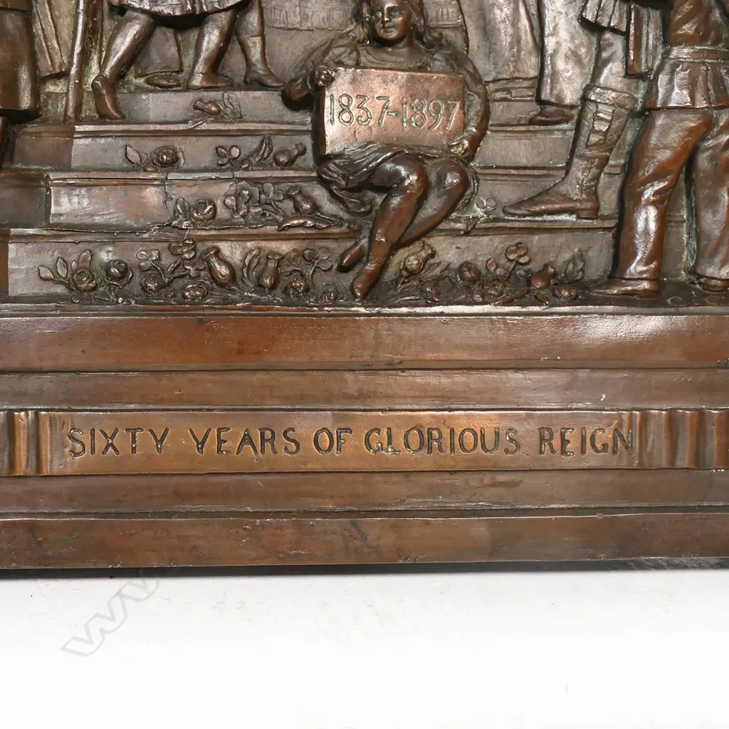 A late Victorian solid bronze plaque - celebrating '60 Years Of Glorious Reign' of Queen Victoria, 1837-1897. Decorated in relief with various military and other figures admiring her portrait plaque under a crowned pelmet and flags. Signed by the sculptor C Caccia. 640 x 430mm. Image 1++