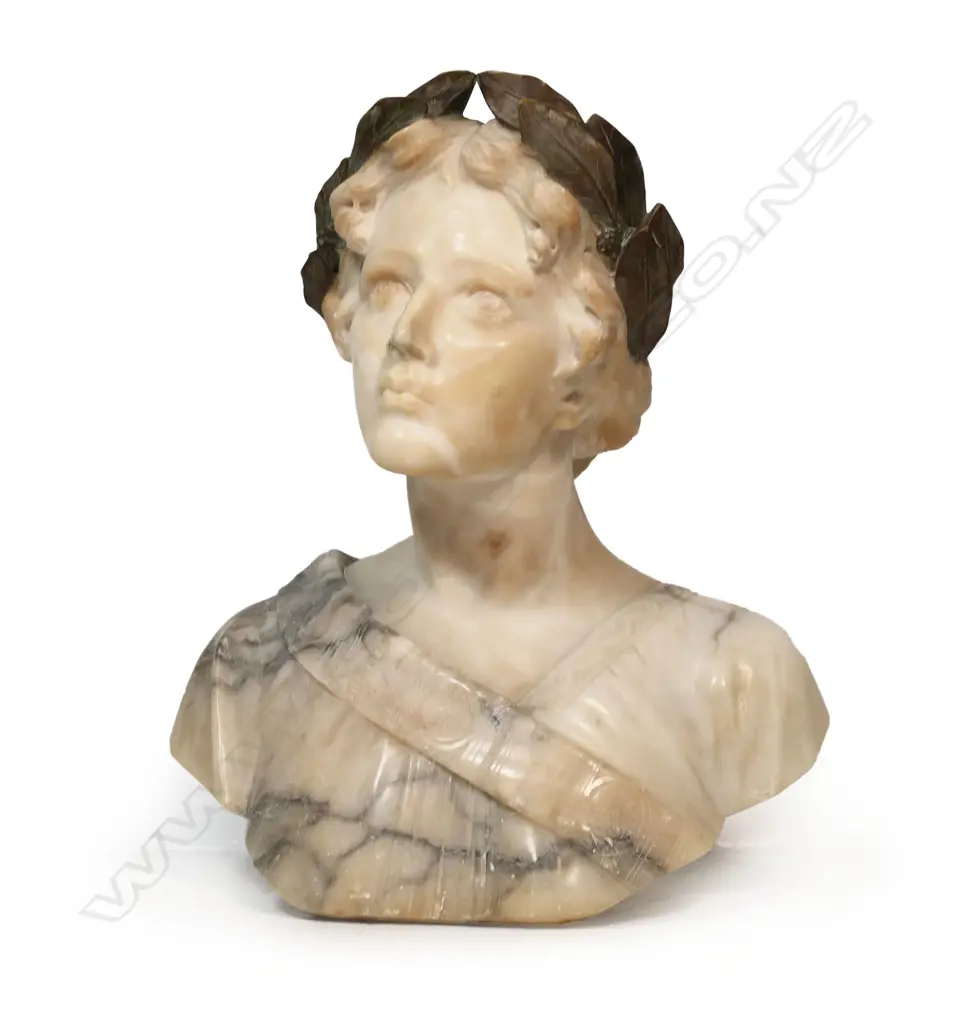 A large carved marble bust of a woman - with laurel wreath about her head, looking upwards, signed Giussepe Bess. Professional repair to nose. H.550mm. Image 1++