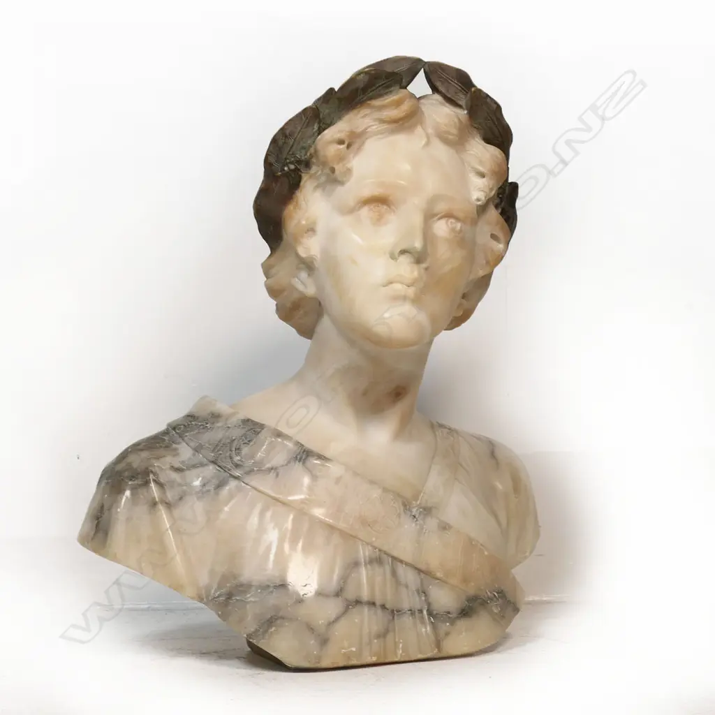A large carved marble bust of a woman - with laurel wreath about her head, looking upwards, signed Giussepe Bess. Professional repair to nose. H.550mm. Image 1++