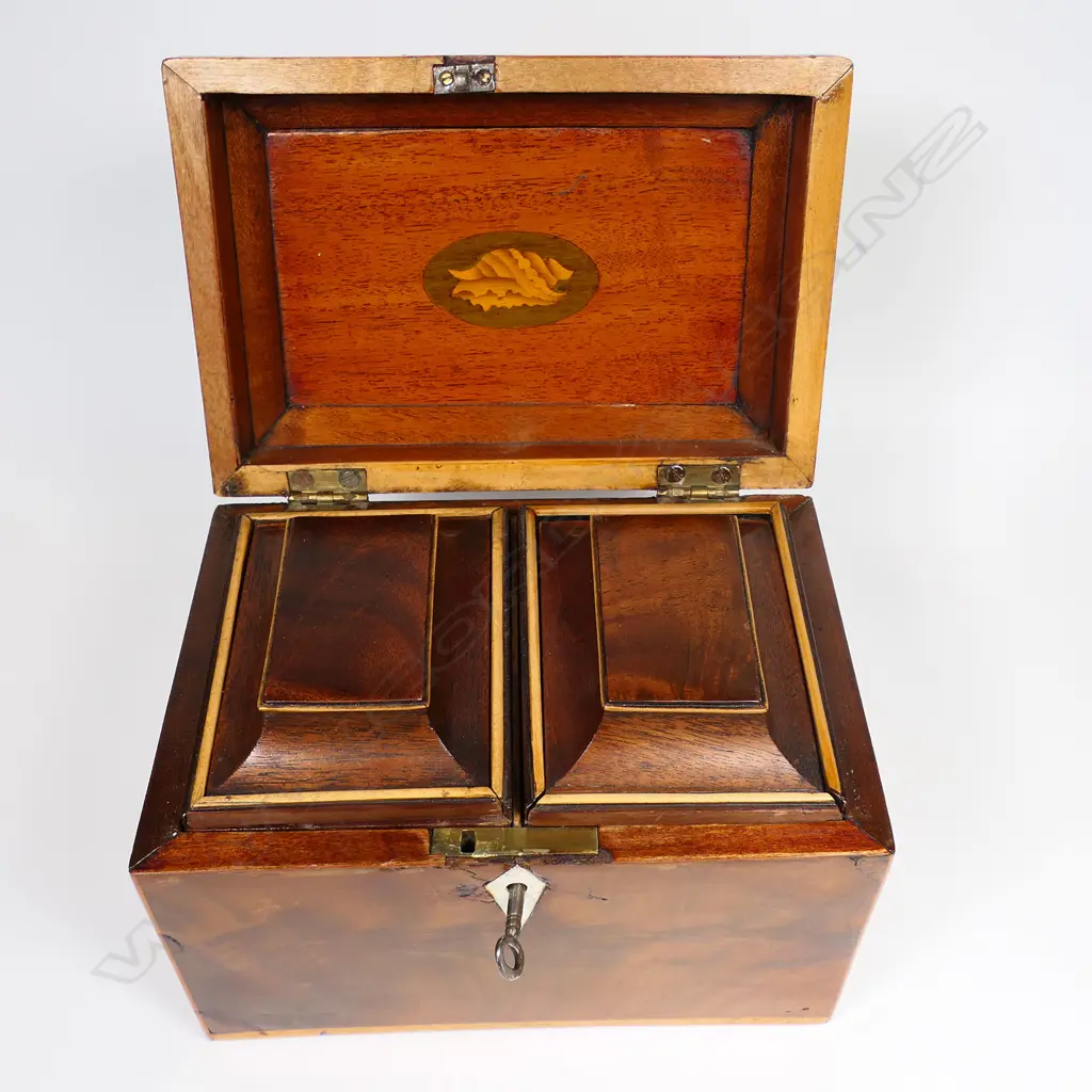 A 19thC small proportioned, flame mahogany veneered, sarcophagus lidded tea caddy - Opening to reveal two sarcophagi sliding lidded, removeable canisters, with pale timber stringing. With key.170 x 115 x 130mm. Image 1++