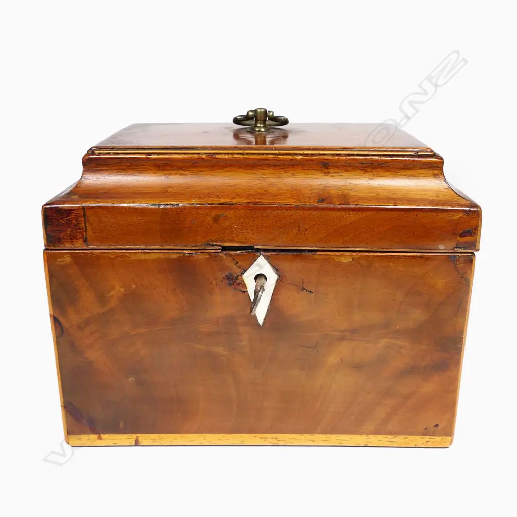 A 19thC small proportioned, flame mahogany veneered, sarcophagus lidded tea caddy - Opening to reveal two sarcophagi sliding lidded, removeable canisters, with pale timber stringing. With key.170 x 115 x 130mm. Image 1++