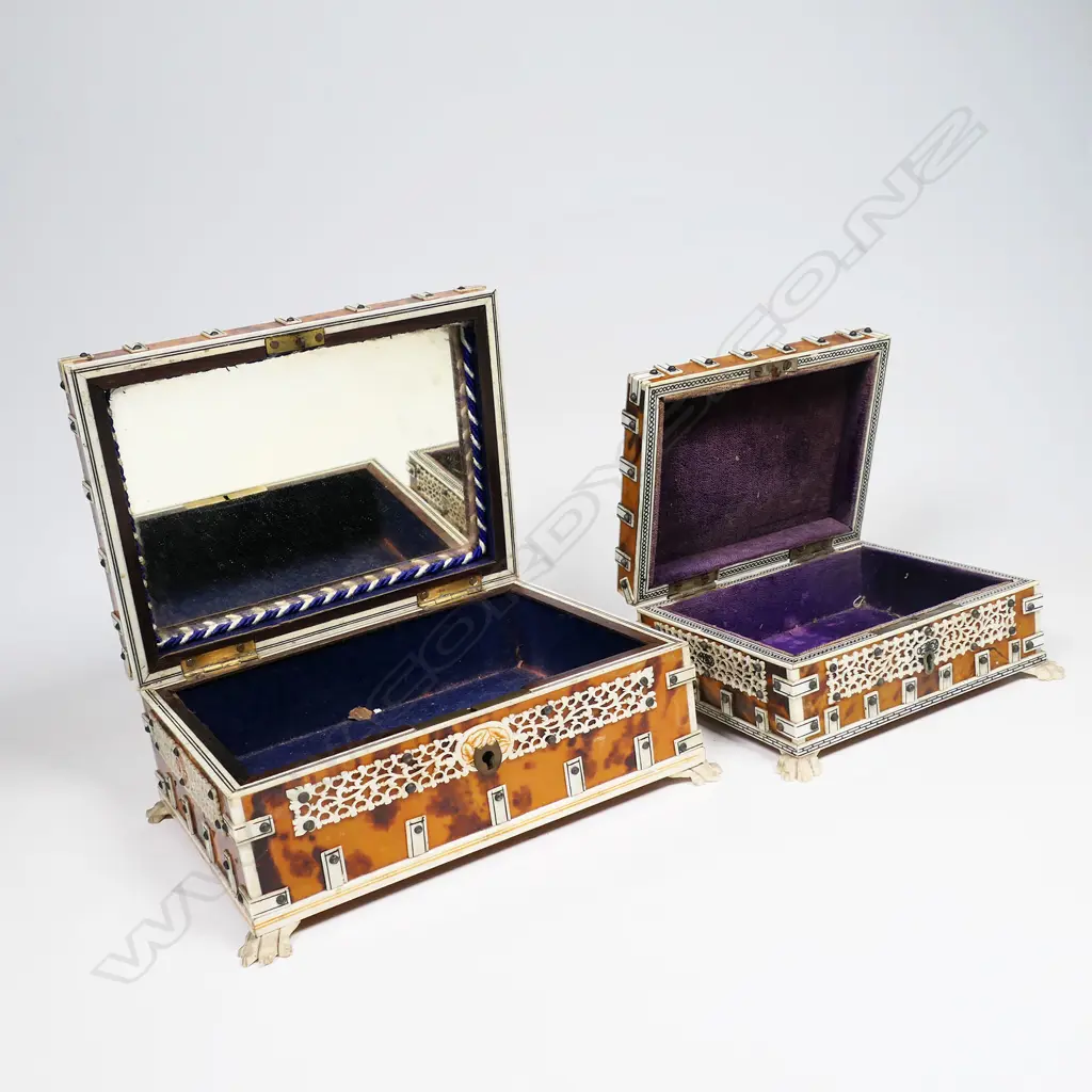 Two antique vizagapatam tortoiseshell and ivory boxes - the ivory with engraved and coloured decoration, the interiors lined, one with a mirror to the lid. Both raised on paw feet. Some old damage. 150 x 120 x 80mm and 120 x 100 x 65mm. Image 1++