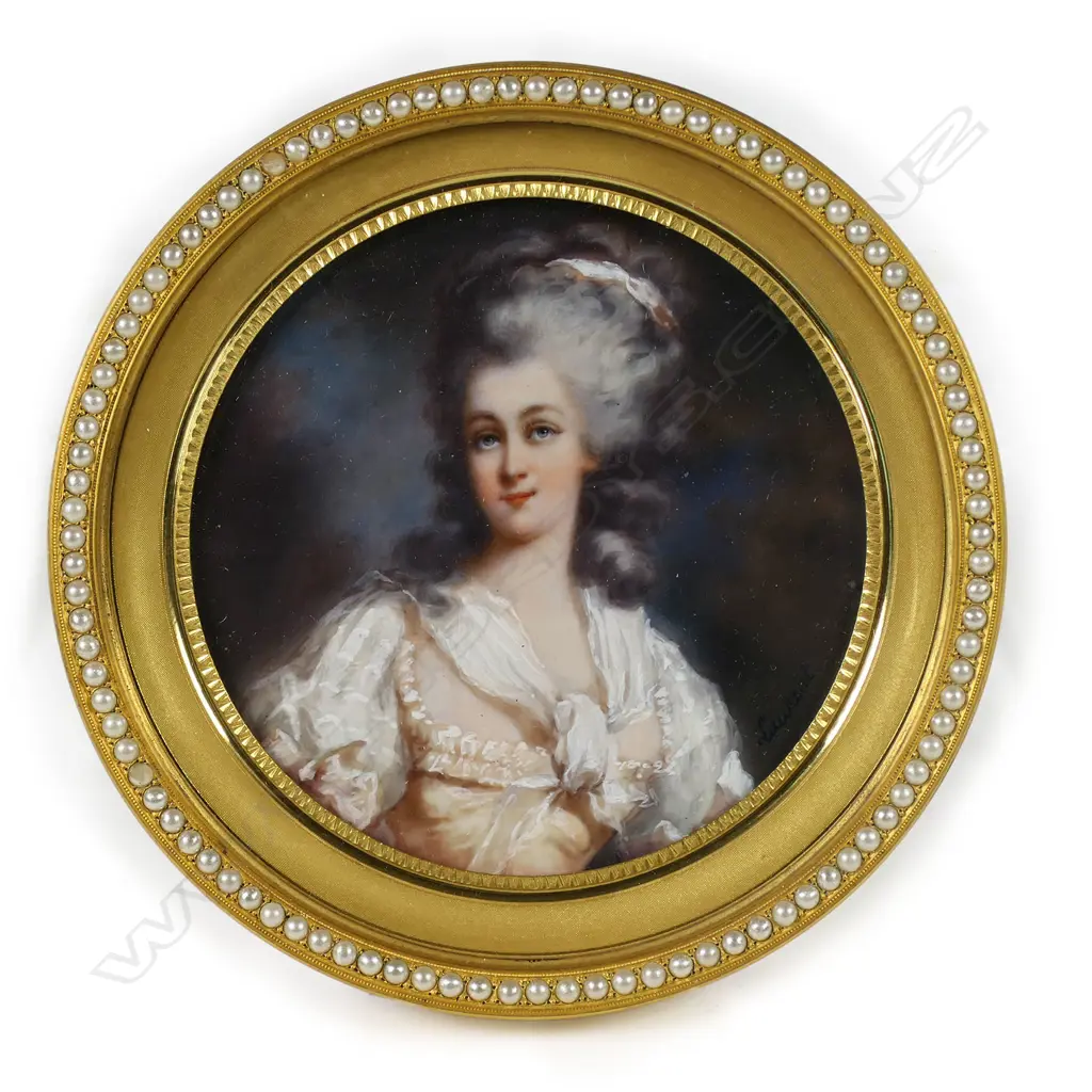 A quality 19thC portrait miniature of a lady in gilt brass jewelled frame - she wears a silk sleeved dress and scarf, a ribbon to her elaborate hair. The frame finely machine engraved and with an encircling band of faux seed pearls. Dia.107mm. Image 1++