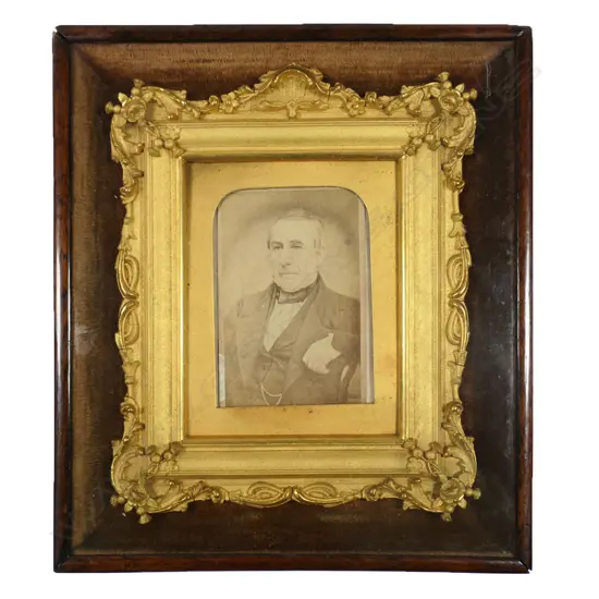 A19thC fancy gilt framed early photo of a gent - the elaborate gilt frame within a mahogany frame under glass with golden brown velvet lining. 220 x190mm,