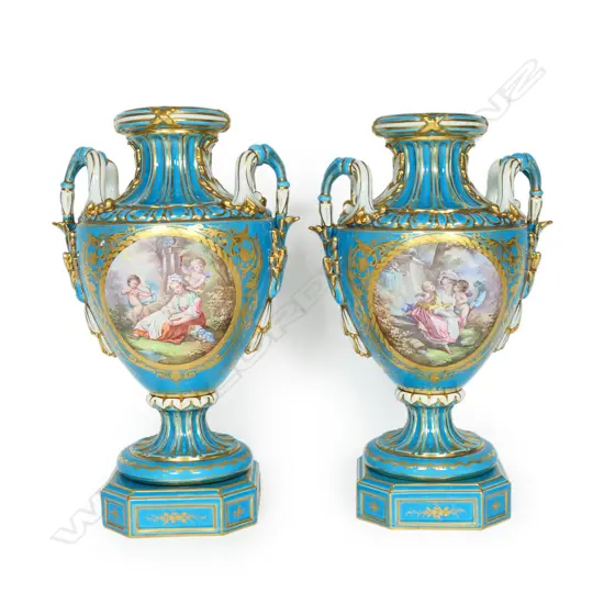 A pair of hand painted 19thC Sèvres porcelain urn vases,