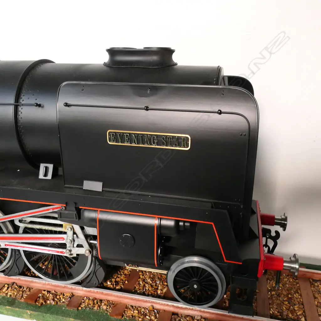A large cased model of a steam train 'Evening Star 92220’ - on realistic track, together with a book and print. 1850 x 240 x 455mm. Provenance: Made by John Borrows, an Auckland engineer who was the brains behind Fisher & Paykel's revolutionary SmartDrive washing machine. In Mr Borrows’ spare time he was a model maker. Image 1++