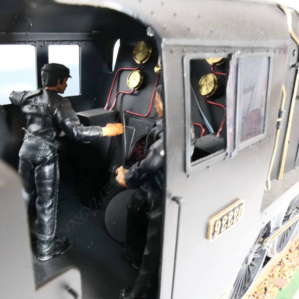 A large cased model of a steam train 'Evening Star 92220’ - on realistic track, together with a book and print. 1850 x 240 x 455mm. Provenance: Made by John Borrows, an Auckland engineer who was the brains behind Fisher & Paykel's revolutionary SmartDrive washing machine. In Mr Borrows’ spare time he was a model maker. Image 1++