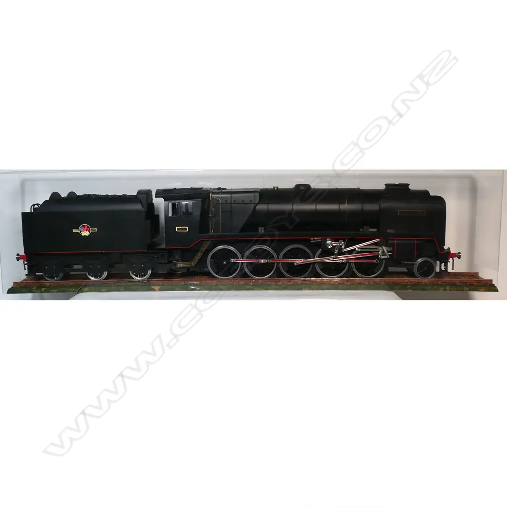 A large cased model of a steam train 'Evening Star 92220’ - on realistic track, together with a book and print. 1850 x 240 x 455mm. Provenance: Made by John Borrows, an Auckland engineer who was the brains behind Fisher & Paykel's revolutionary SmartDrive washing machine. In Mr Borrows’ spare time he was a model maker. Image 1++