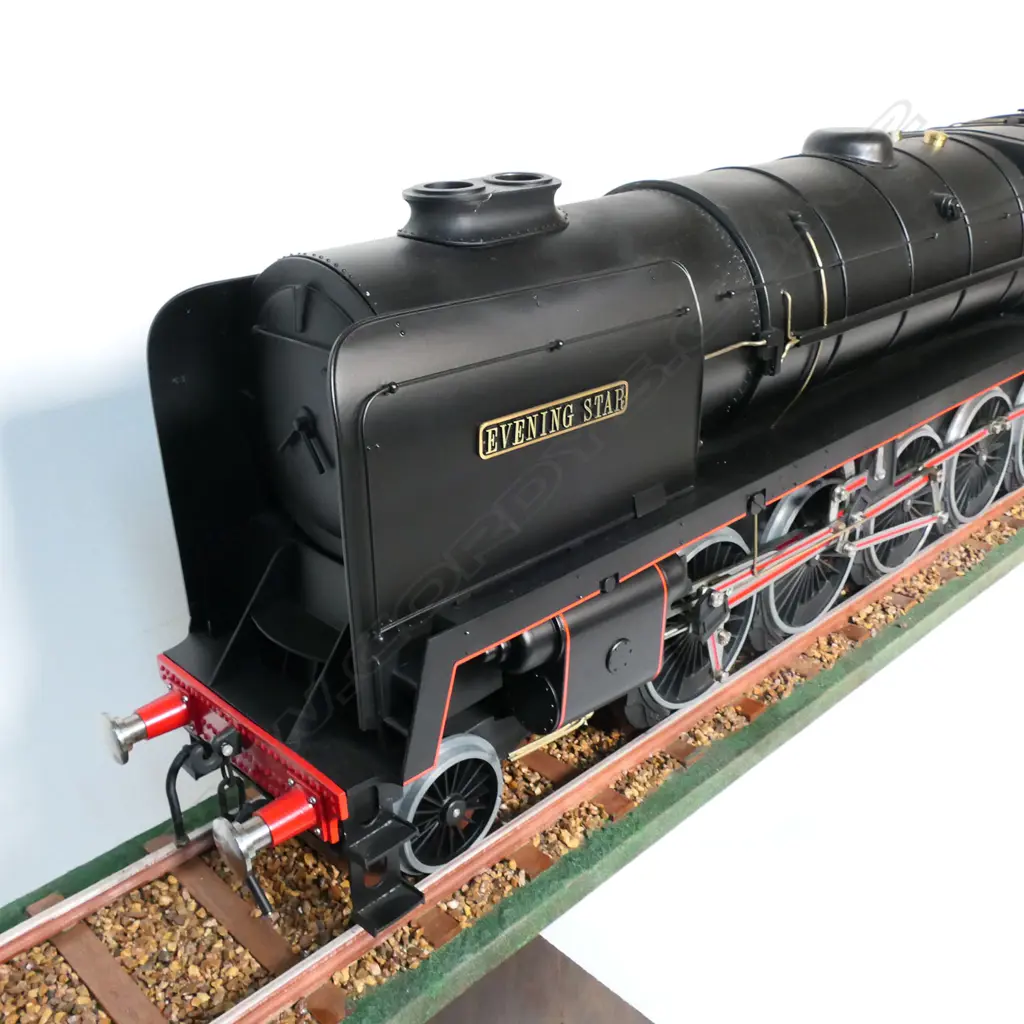 A large cased model of a steam train 'Evening Star 92220’ - on realistic track, together with a book and print. 1850 x 240 x 455mm. Provenance: Made by John Borrows, an Auckland engineer who was the brains behind Fisher & Paykel's revolutionary SmartDrive washing machine. In Mr Borrows’ spare time he was a model maker. Image 1++