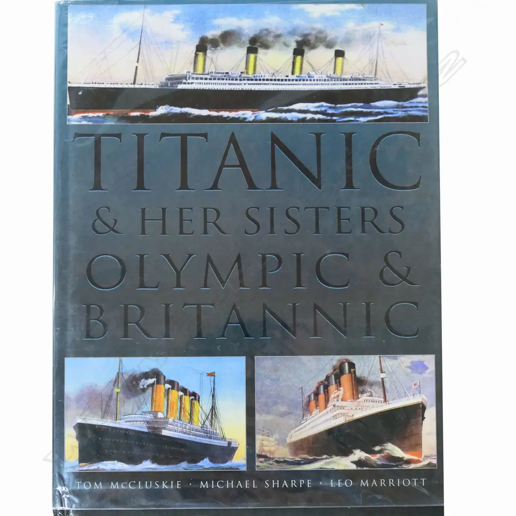 A model of RMS Titanic - on mirrored base and table, together with eight Titanic books and a jigsaw puzzle. L.1375mm. Image 1++