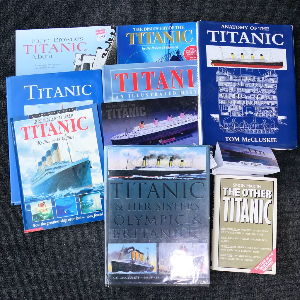 A model of RMS Titanic - on mirrored base and table, together with eight Titanic books and a jigsaw puzzle. L.1375mm. Image 1++