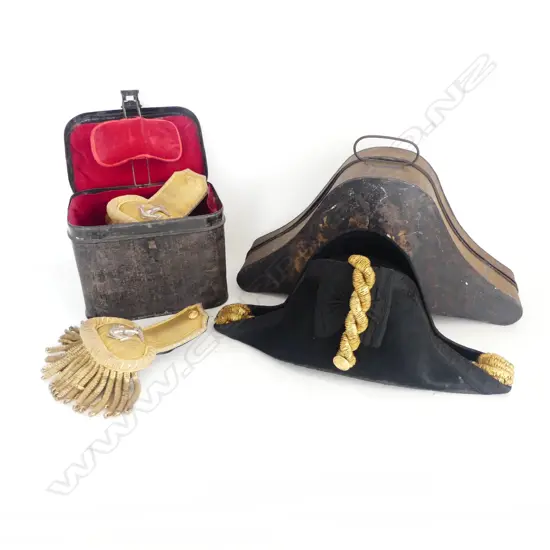 A Victorian regulation Royal Navy bi-corn hat and epaulettes - both in original blackened tin transit cases and with gold bullion wire. The hat with maker's details inside MOORE SCANTLEBURY & COOTE. THE HARD. PORTSMOUTH.