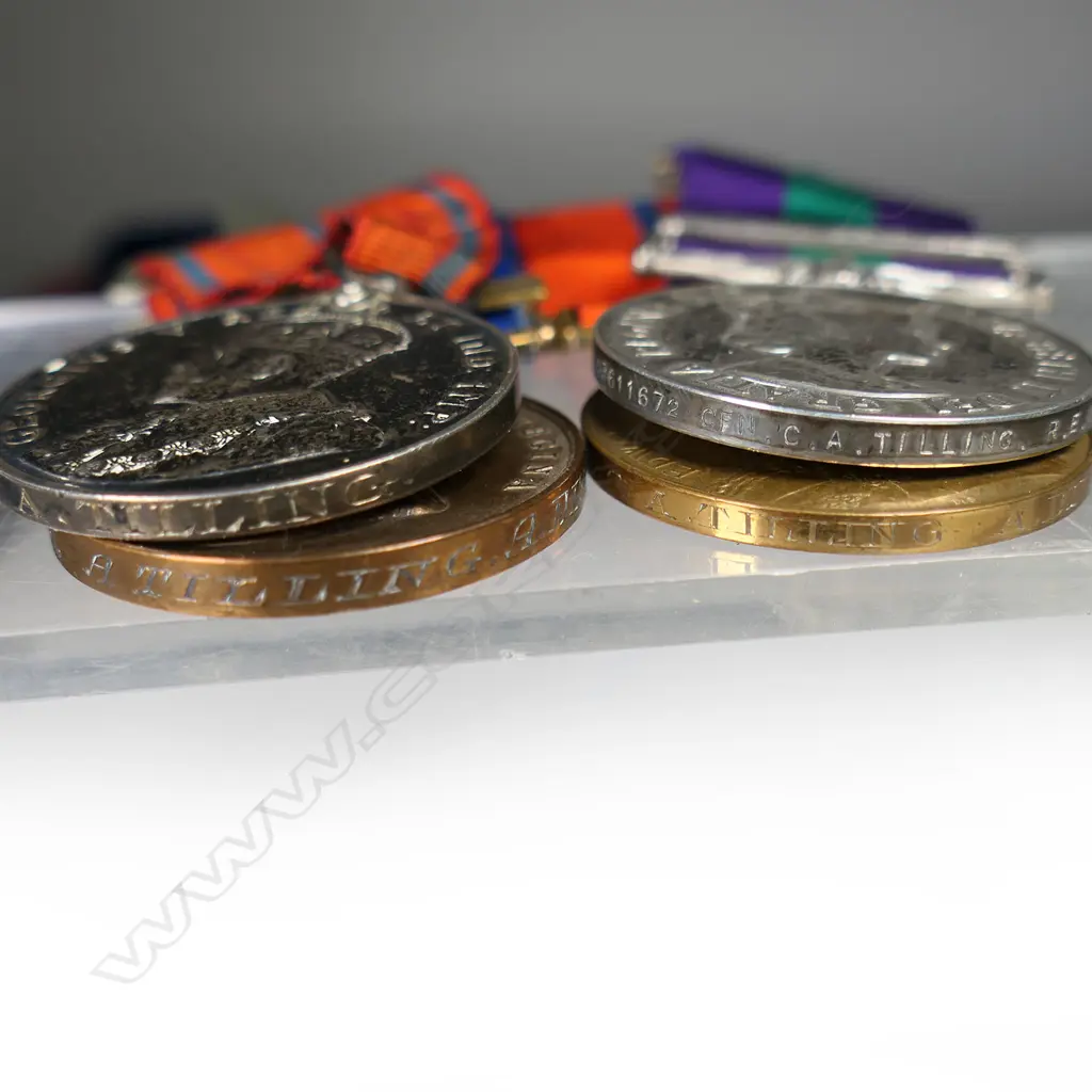 Five English coronation, jubilee and service medals to Police Constable A.Tilling and family - Metropolitan Police Victoria Jubilee medal 1887 with 1897 bar, Metropolitan Police Edw VII coronation medal, Metropolitan Police George V coronation medal, all to A.Tilling; QEII GSM with Arabian Peninsula bar to CFN C.A. Tilling REME; QEII coronation medal framed with a photo of an early 20thC Post Office Messenger Boy Image 1++