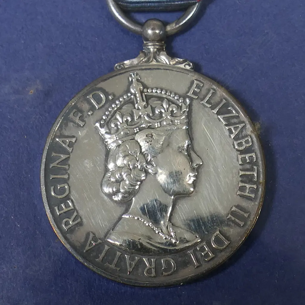 Five English coronation, jubilee and service medals to Police Constable A.Tilling and family - Metropolitan Police Victoria Jubilee medal 1887 with 1897 bar, Metropolitan Police Edw VII coronation medal, Metropolitan Police George V coronation medal, all to A.Tilling; QEII GSM with Arabian Peninsula bar to CFN C.A. Tilling REME; QEII coronation medal framed with a photo of an early 20thC Post Office Messenger Boy Image 1++