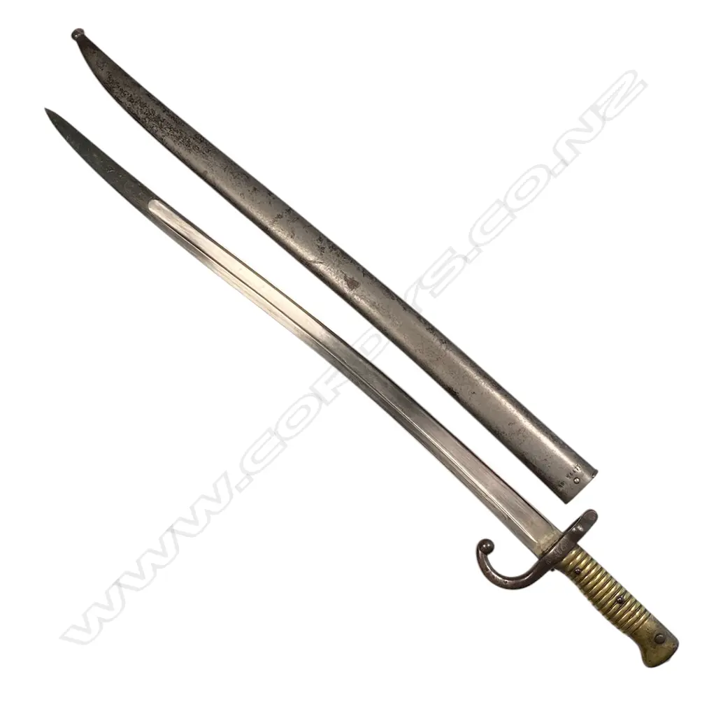A 19thC French bayonet - fullered blade, dated 1873, hooked quillon, with scabbard. L.700mm. Image 1++
