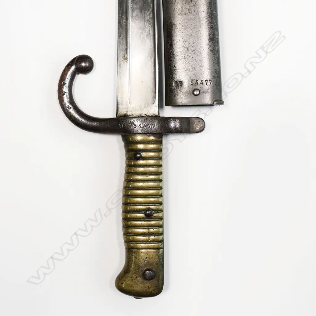 A 19thC French bayonet - fullered blade, dated 1873, hooked quillon, with scabbard. L.700mm. Image 1++