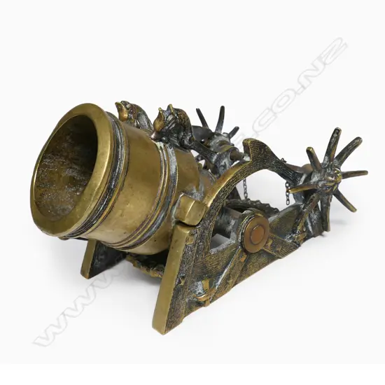 A French bronze model of a cannon à mortier (mortar cannon) signed M (Maxime) le Vérrier - the short and wide barrel supported in a simulated wooden frame, elevated by a ratchet system (chains broken). L.185mm,